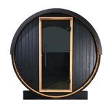 Front view of the Panther 2-person barrel sauna with a glass door for a clear outdoor view, thermally-modified black pine exterior